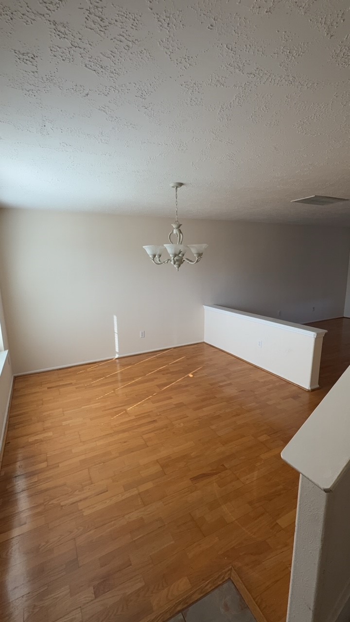 6014 Pinacle Point Houston, TX 77085 - Photo 5 of 27 wooden floor in an empty room