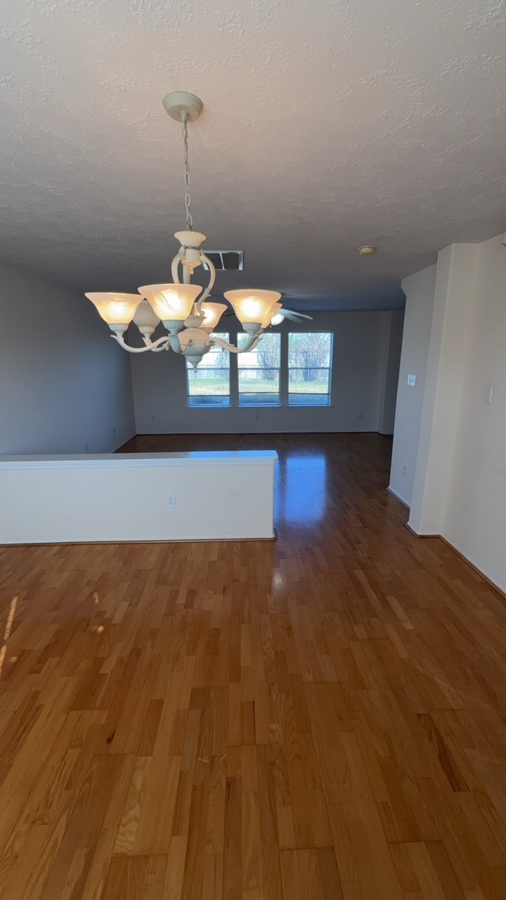 6014 Pinacle Point Houston, TX 77085 - Photo 7 of 27 a room with water heater and wooden floor