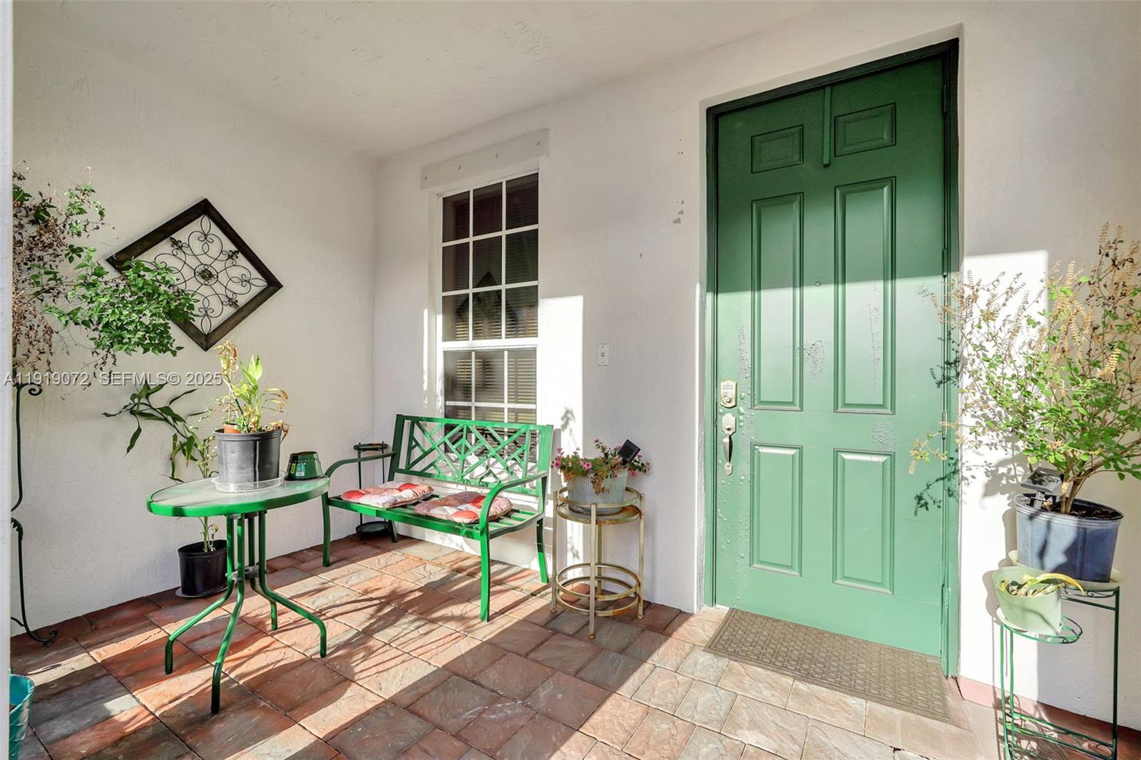 9213 Southwest 170th Avenue Miami, FL 33196 - Photo 15 of 82 a living room filled with furniture and a potted plant