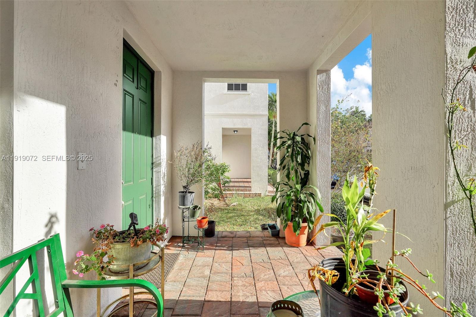 9213 Southwest 170th Avenue Miami, FL 33196 - Photo 17 of 82 a living room with furniture and a potted plant