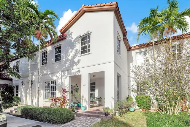 a living room with furniture ceiling fan and a rug