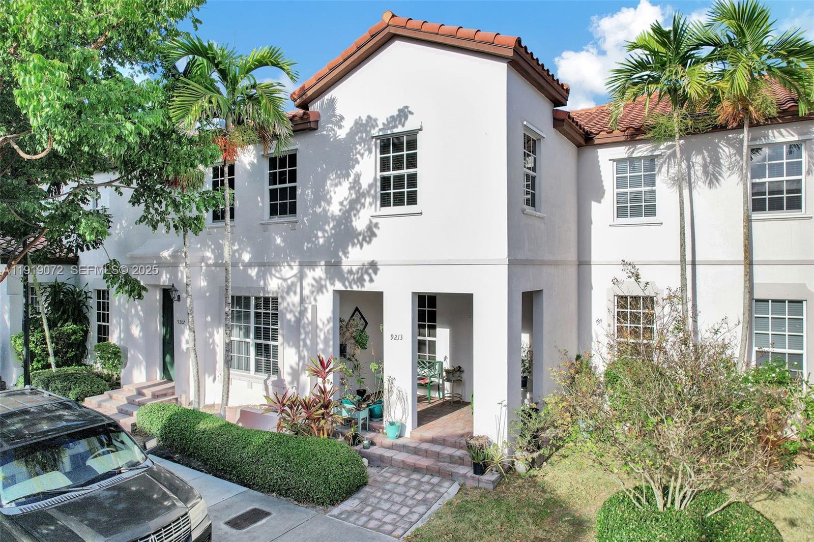 9213 Southwest 170th Avenue Miami, FL 33196 - Photo 20 of 82 a front view of a house with a yard