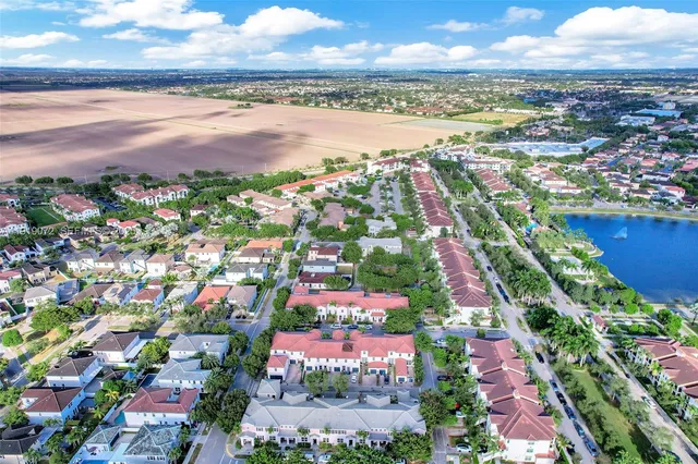 a view of a hallway with wooden floor and closet