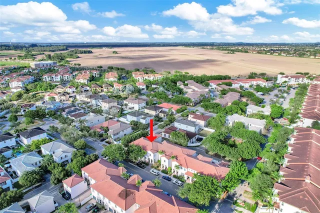 a view of a hallway view with wooden floor and staircase