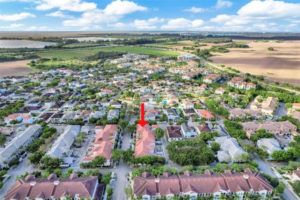 a bedroom with bed and a window