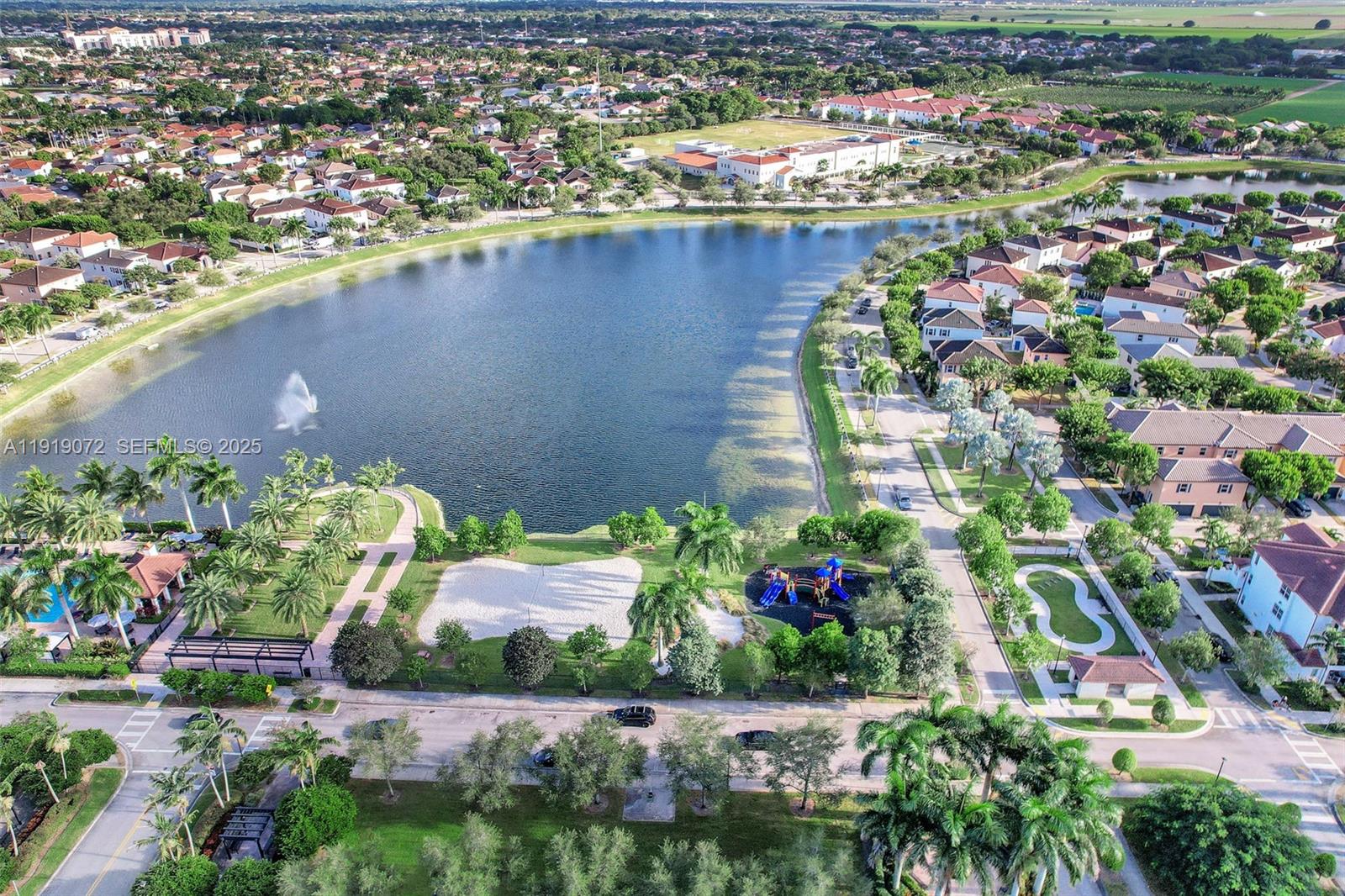 9213 Southwest 170th Avenue Miami, FL 33196 - Photo 33 of 82 an aerial view of a house with a yard and lake view