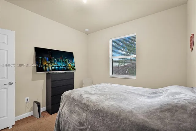 a dining room with furniture entryway and wooden floor