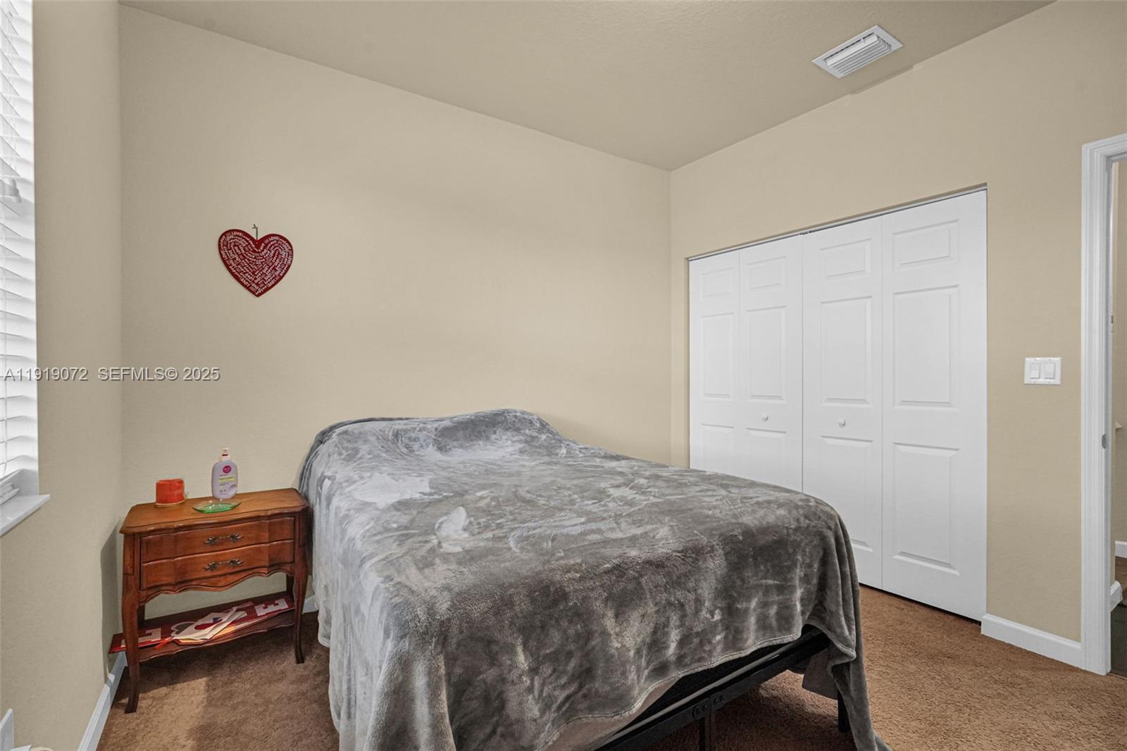 9213 Southwest 170th Avenue Miami, FL 33196 - Photo 45 of 82 a bedroom with a bed and a dresser