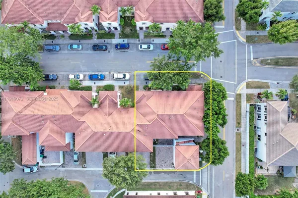 a view of a house with a yard and sitting area