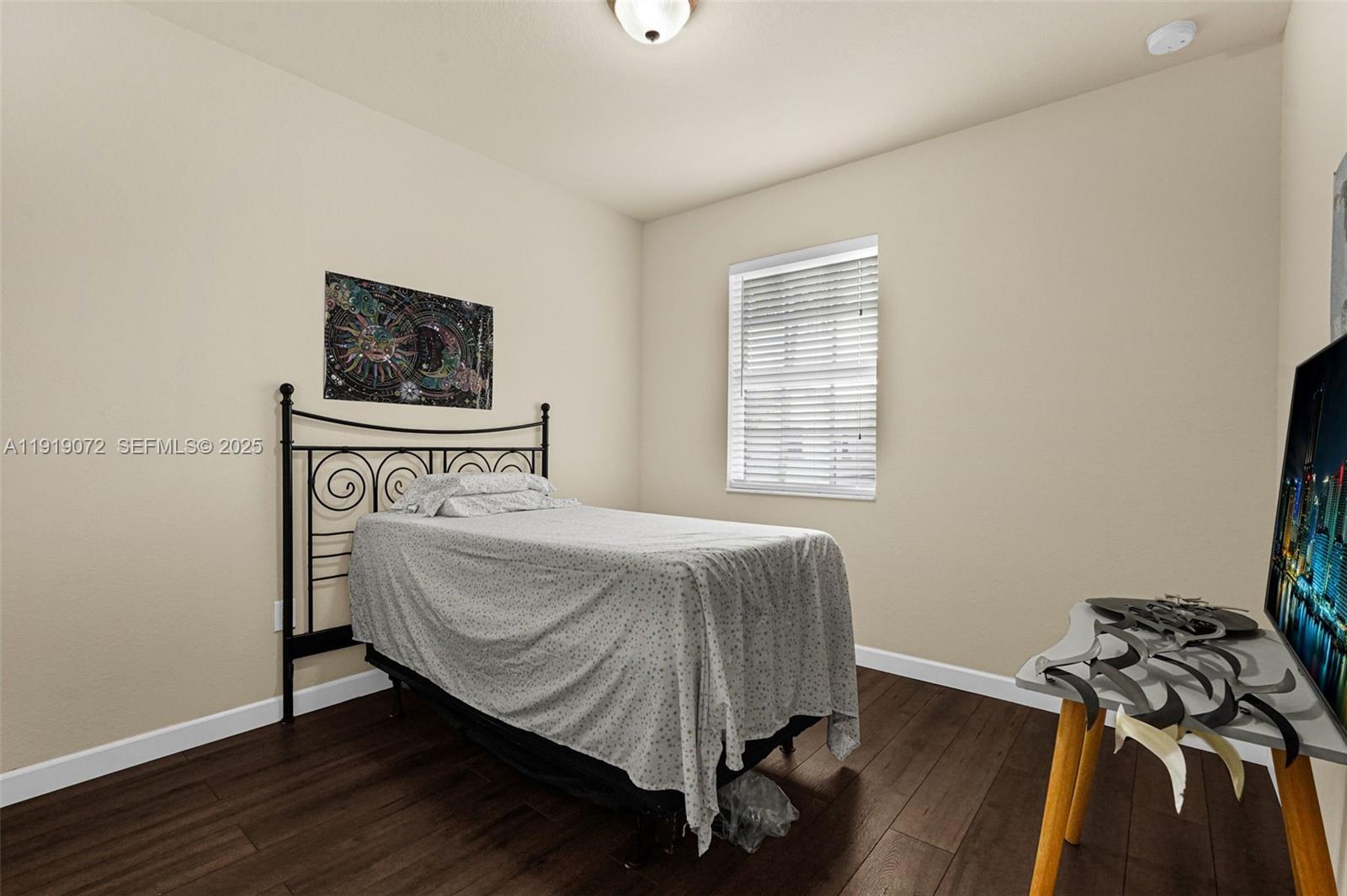 9213 Southwest 170th Avenue Miami, FL 33196 - Photo 56 of 82 a bedroom with a bed and a window