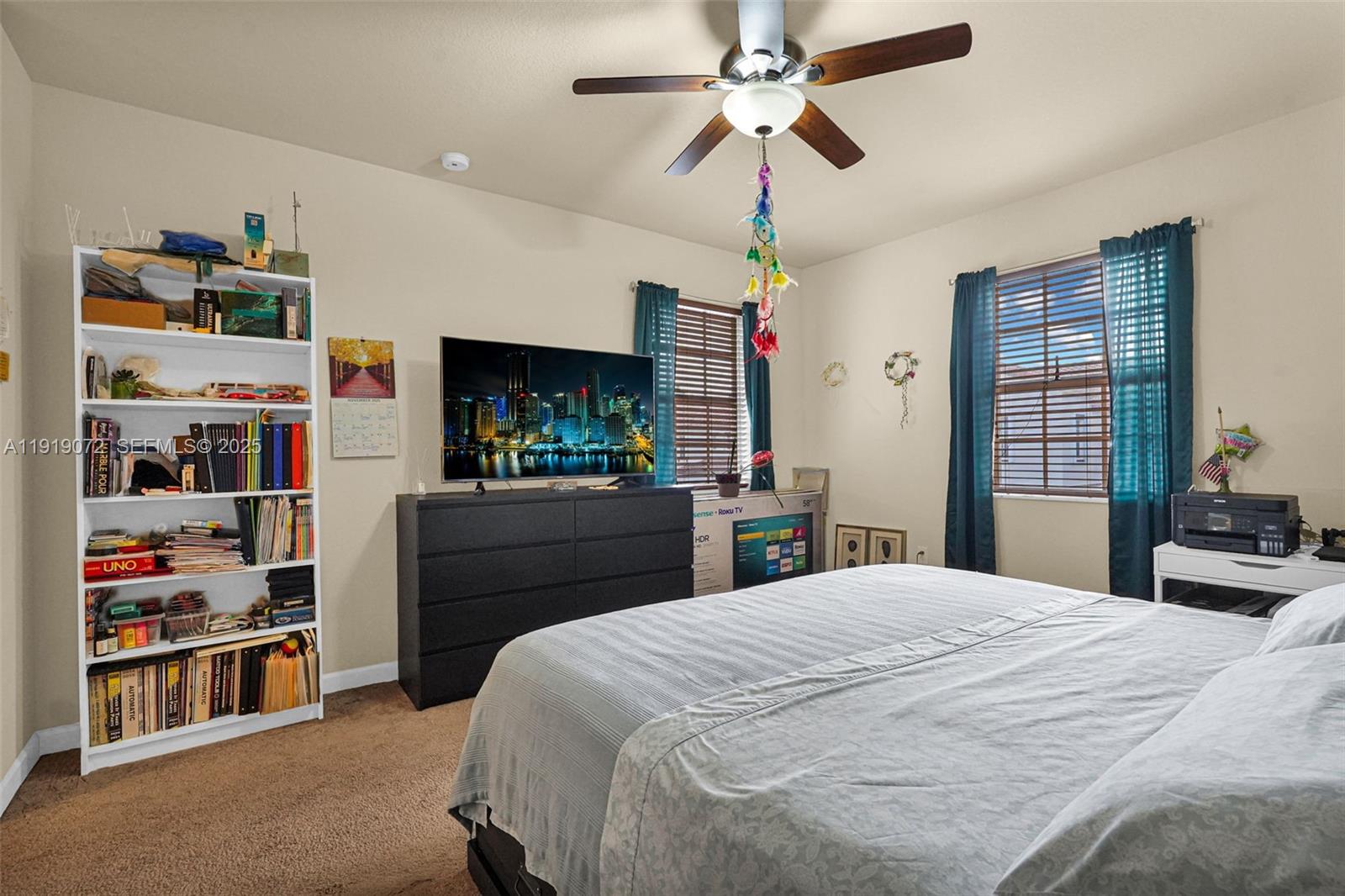 9213 Southwest 170th Avenue Miami, FL 33196 - Photo 64 of 82 a bedroom with a bed and a bookshelf