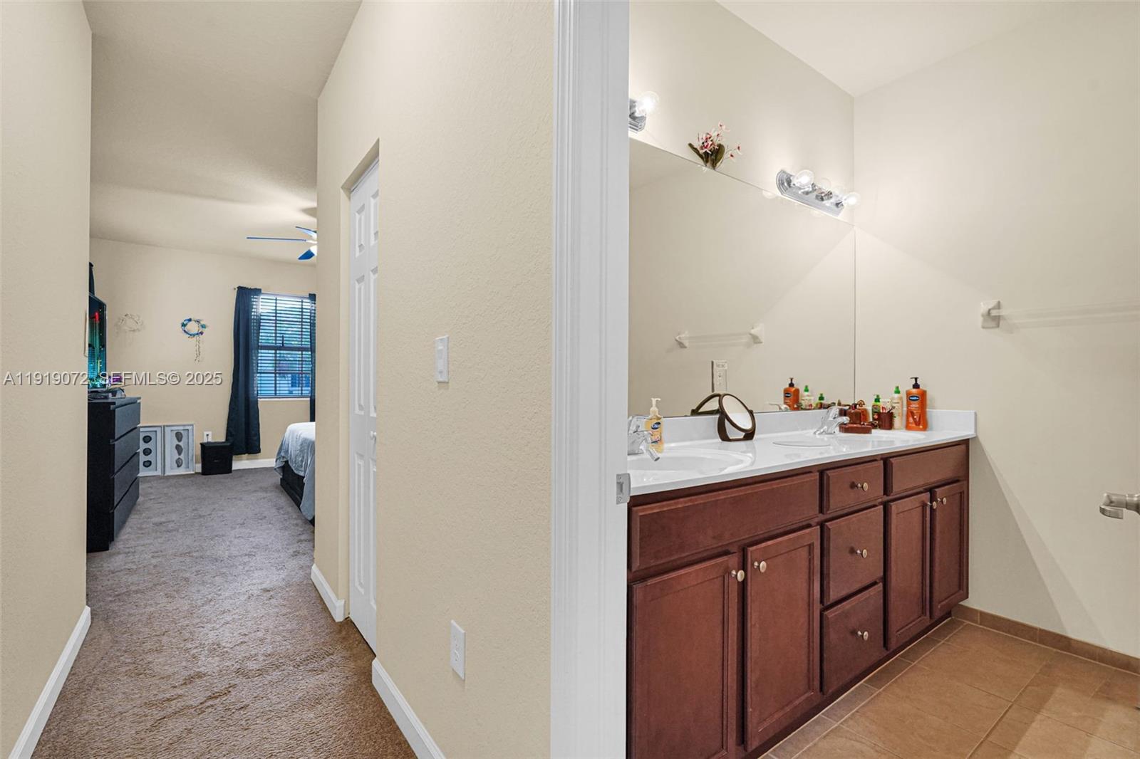 9213 Southwest 170th Avenue Miami, FL 33196 - Photo 67 of 82 a spacious bathroom with a double vanity sink and a mirror