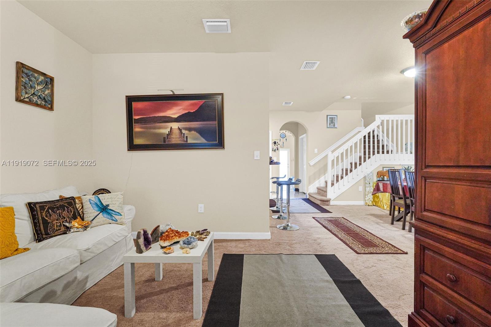 9213 Southwest 170th Avenue Miami, FL 33196 - Photo 70 of 82 a living room with furniture and a rug