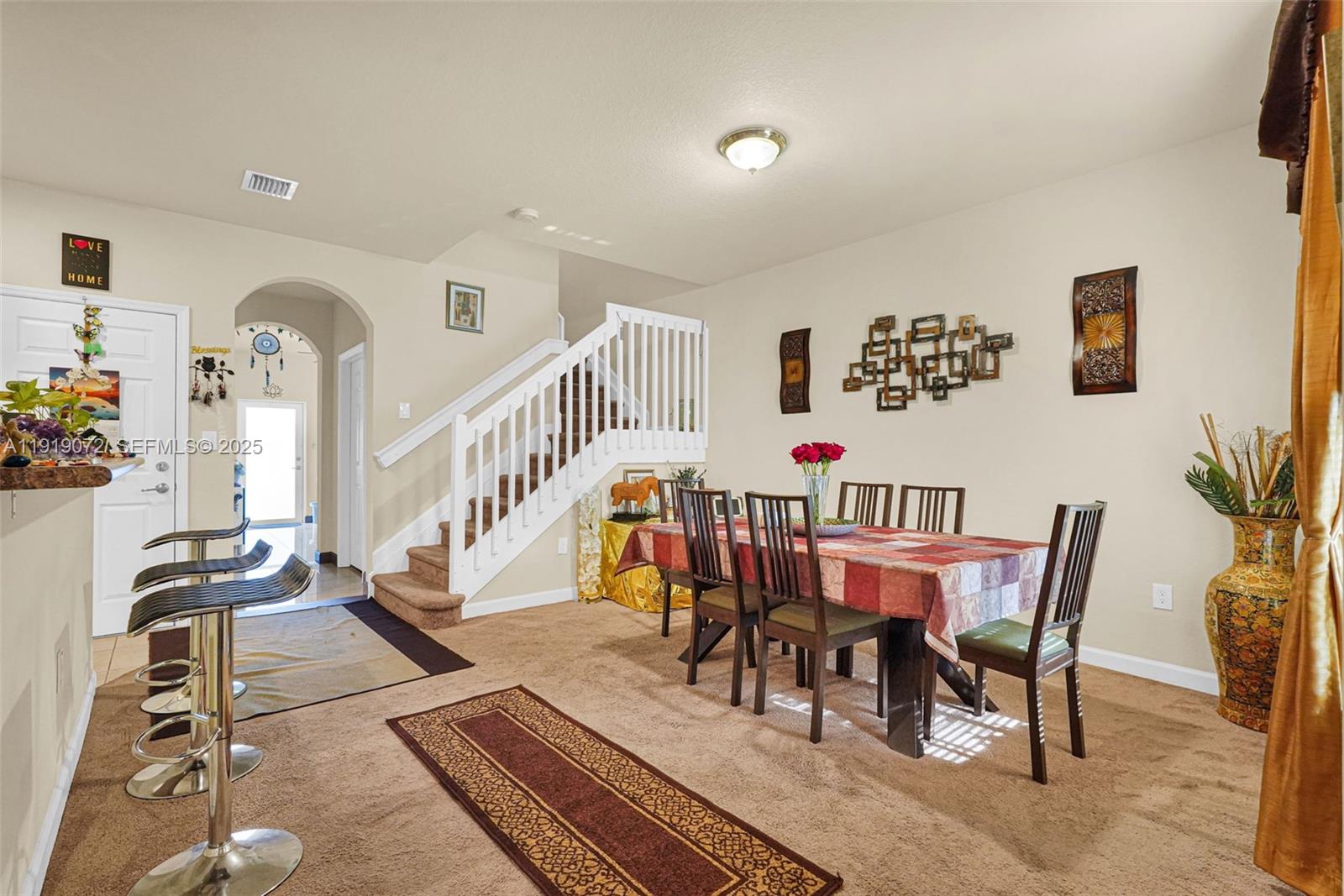 9213 Southwest 170th Avenue Miami, FL 33196 - Photo 72 of 82 a dining room with furniture entryway and wooden floor