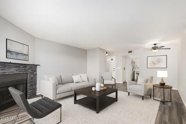 a living room with furniture and a fireplace