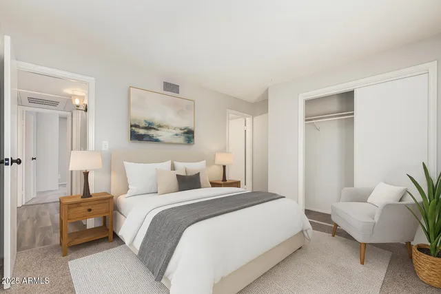 a bedroom with a bed and a couch