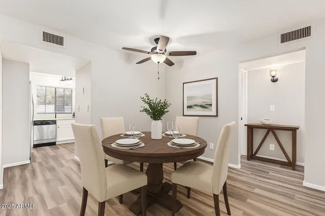 a view of a dining room with furniture and wooden floor