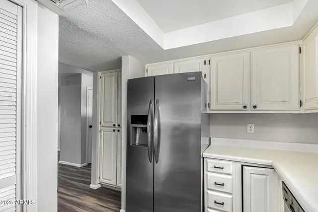 a kitchen with stainless steel appliances cabinets and a counter top space