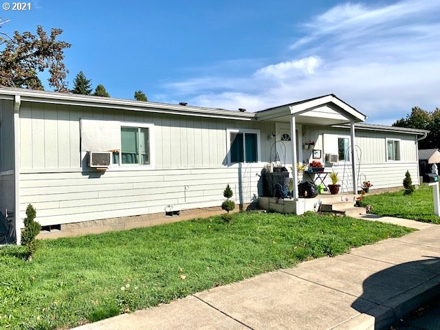 205 57th Street Springfield, OR 97478 - Photo 2 of 13 a front view of a house with a yard