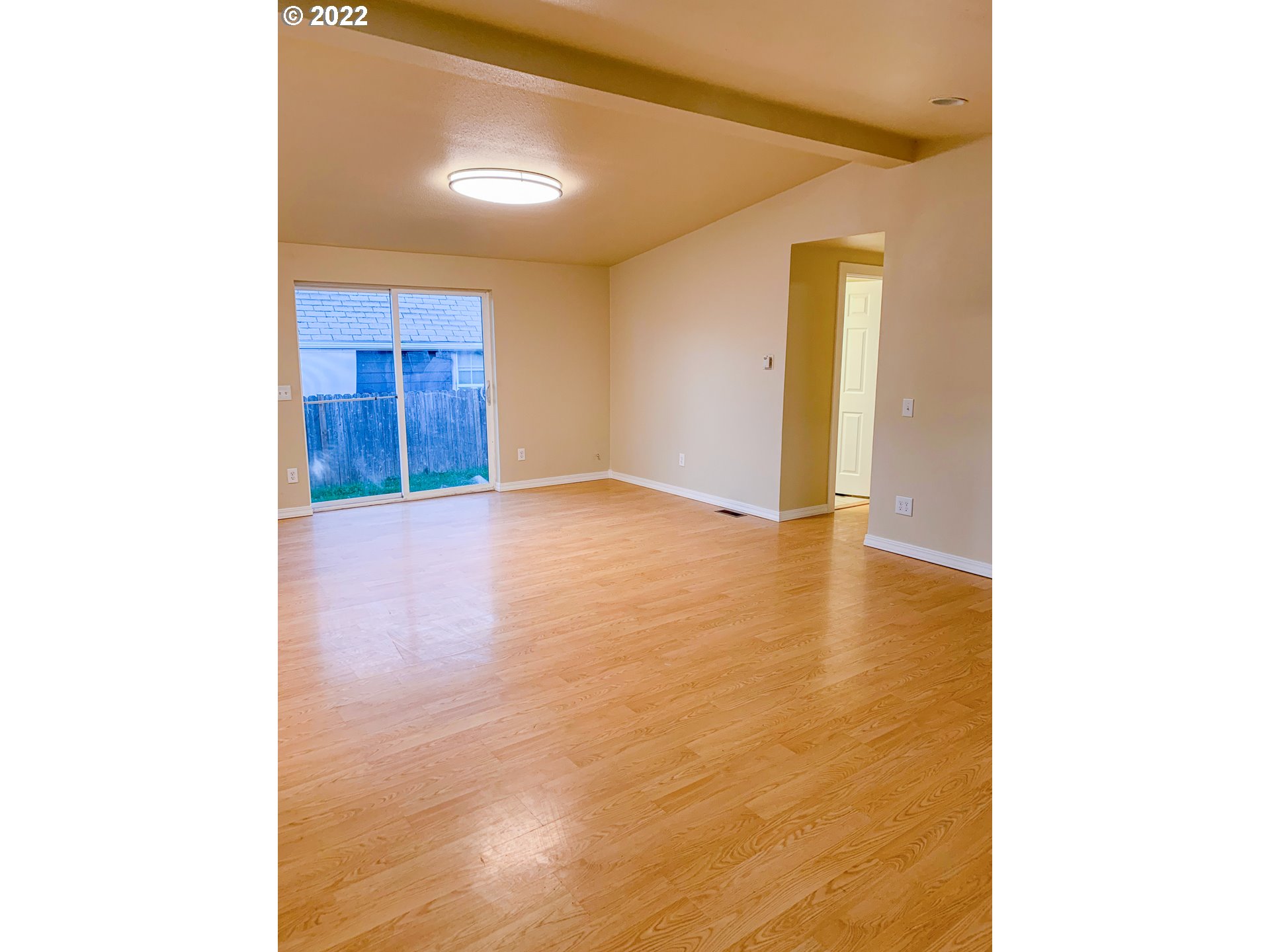 205 57th Street Springfield, OR 97478 - Photo 3 of 13 a view of an empty room with wooden floor