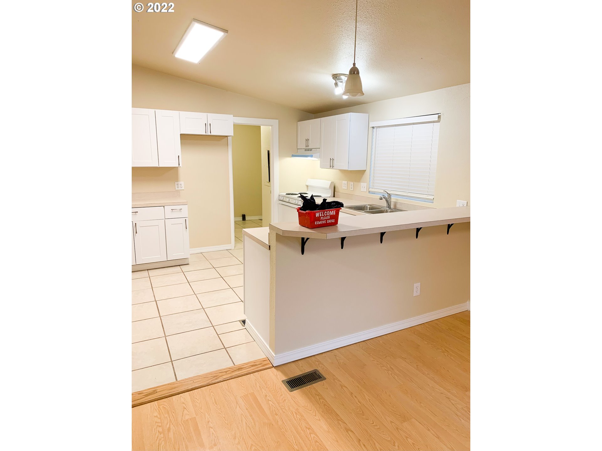 205 57th Street Springfield, OR 97478 - Photo 4 of 13 a kitchen with a sink and cabinets