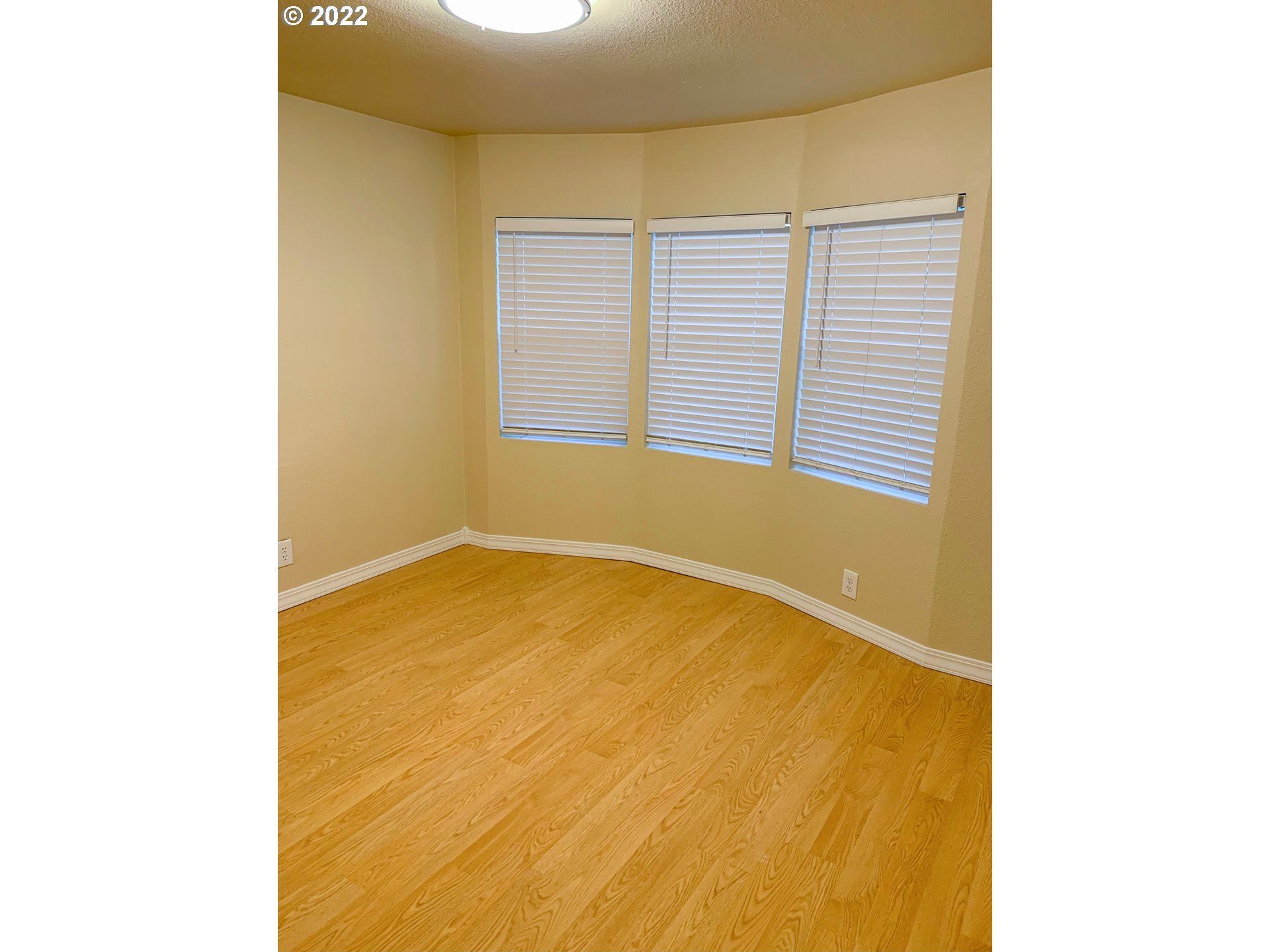 205 57th Street Springfield, OR 97478 - Photo 8 of 13 a view of an empty room with a window