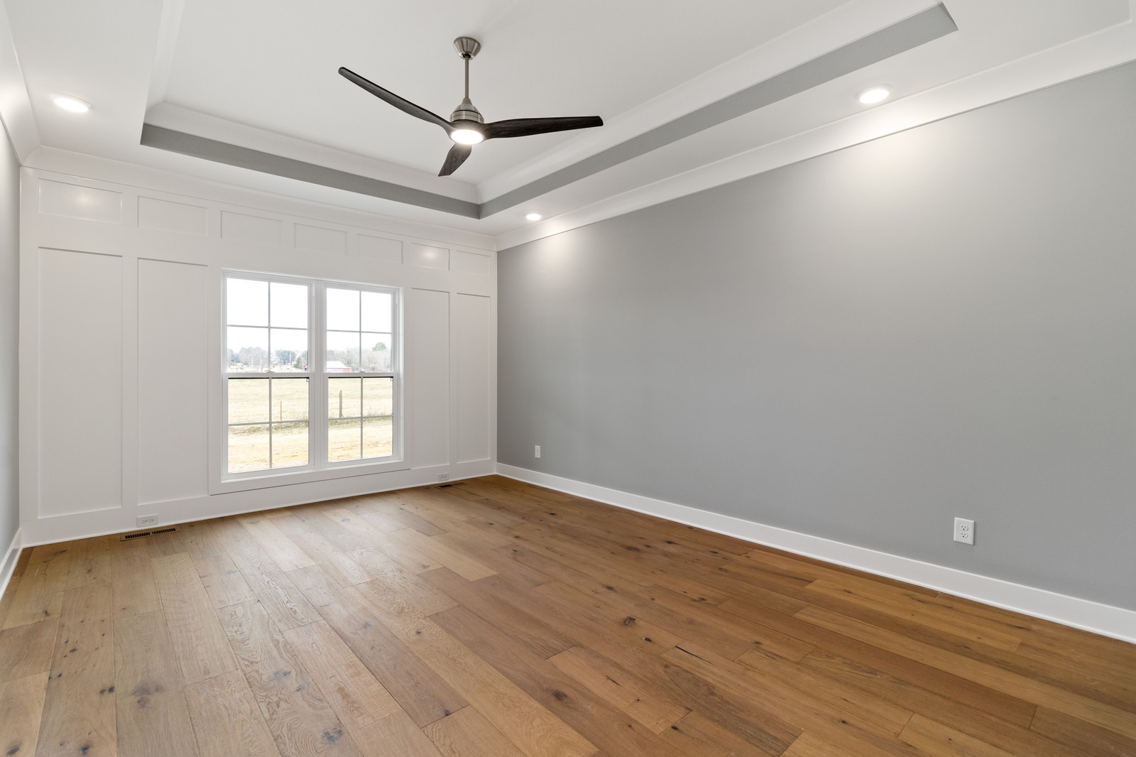 24 Port Royal Estate Adams, TN 37010 - Photo 18 of 34 an empty room with wooden floor fan and windows