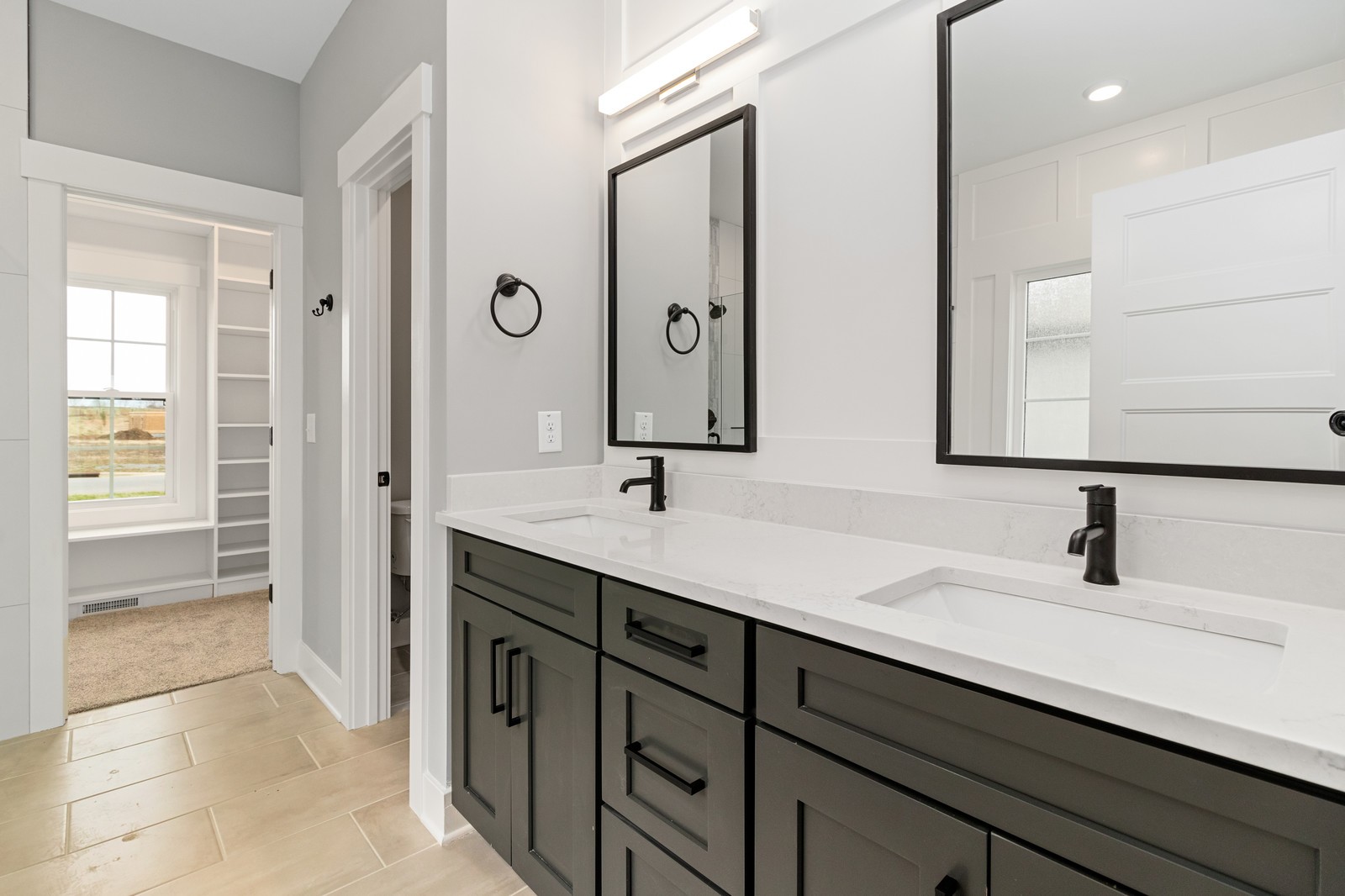 24 Port Royal Estate Adams, TN 37010 - Photo 20 of 34 a bathroom with a double vanity sink a mirror and a shower