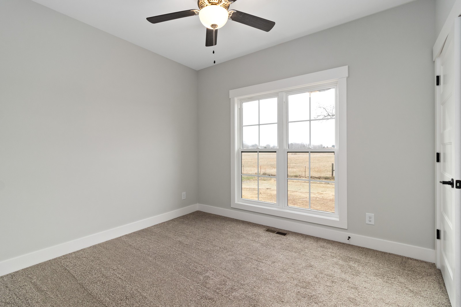 24 Port Royal Estate Adams, TN 37010 - Photo 23 of 34 an empty room with a window and a fan