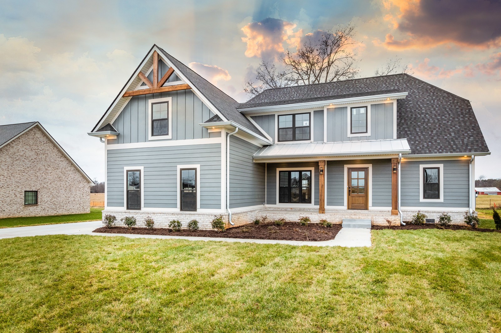 24 Port Royal Estate Adams, TN 37010 - Photo 5 of 34 a front view of a house with a yard table and chairs