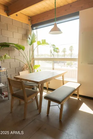 a view of a dining room with furniture window and outside view