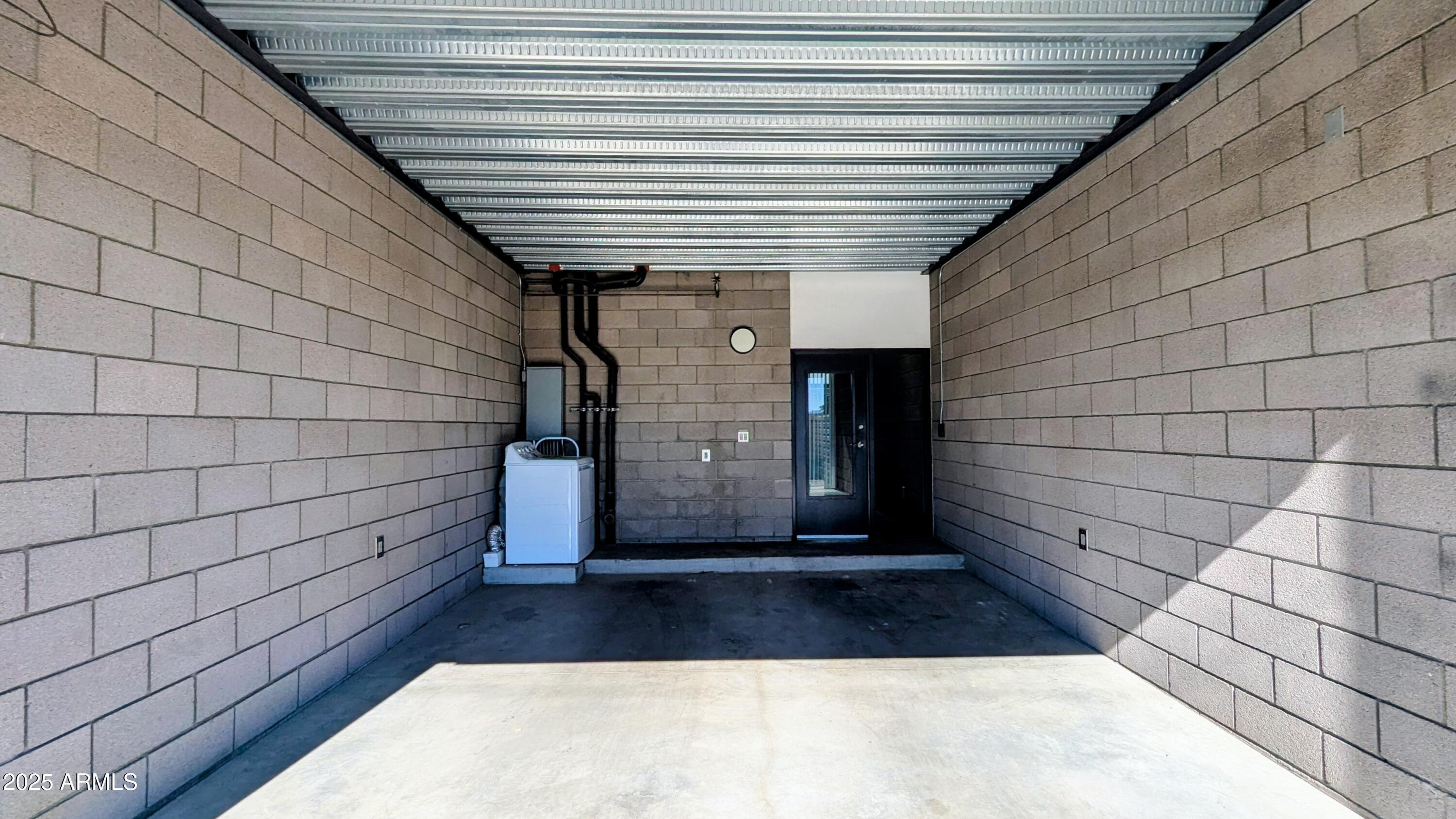 525 East Willetta Street, Unit 8 Phoenix, AZ 85004 - Photo 24 of 25 a view of empty room with window and brick walls