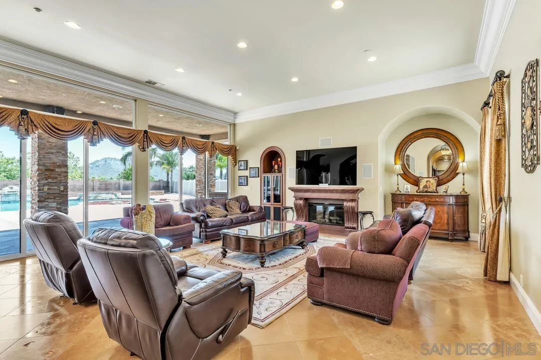 10321 Hitching Post Way Santee, CA 92071 - Photo 12 of 75 a living room with fireplace furniture and a large window