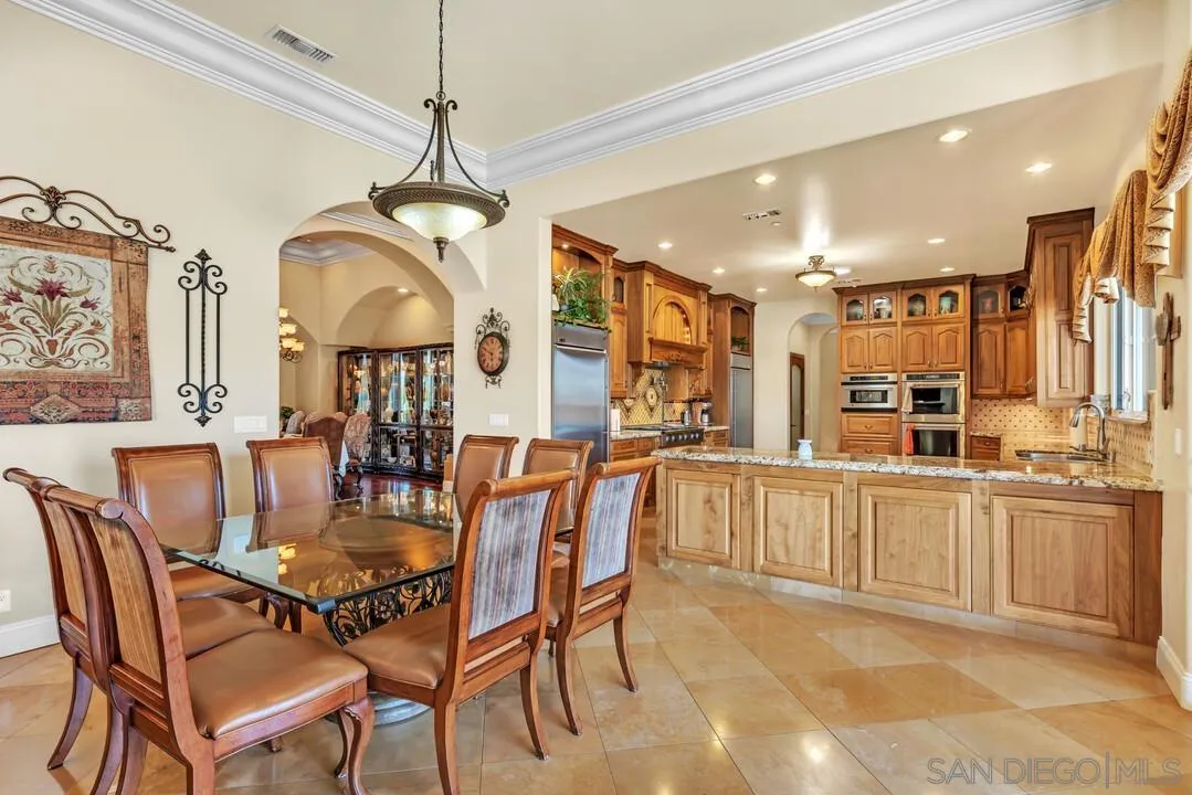 10321 Hitching Post Way Santee, CA 92071 - Photo 18 of 75 a view of a dining room and livingroom with furniture wooden floor a chandelier