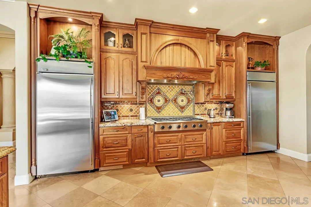 10321 Hitching Post Way Santee, CA 92071 - Photo 23 of 75 a kitchen with stainless steel appliances granite countertop a refrigerator and a stove