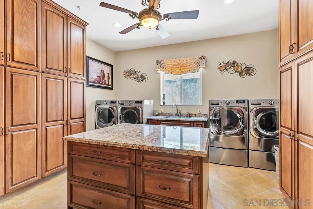 10321 Hitching Post Way Santee, CA 92071 - Photo 30 of 75 a kitchen with furniture a refrigerator and a stove