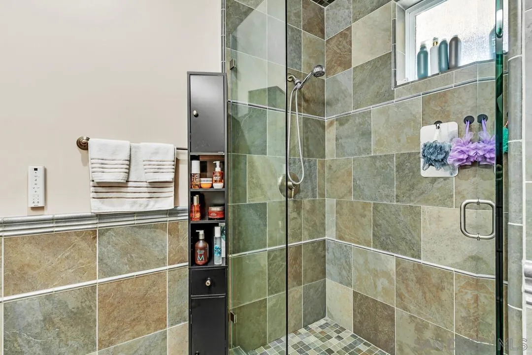 10321 Hitching Post Way Santee, CA 92071 - Photo 34 of 75 a bathroom with a glass shower door