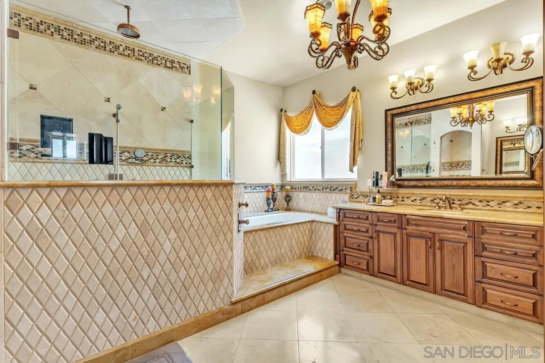 10321 Hitching Post Way Santee, CA 92071 - Photo 49 of 75 a bathroom with a sink and a large mirror