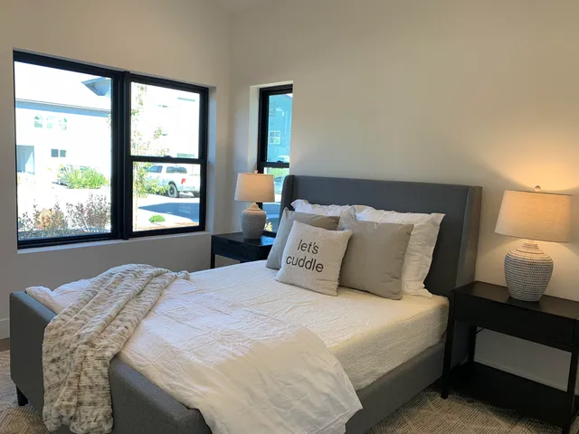 a bedroom with a bed and window