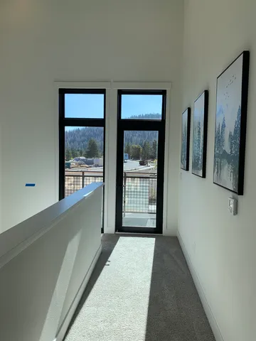 a view of a room with large windows