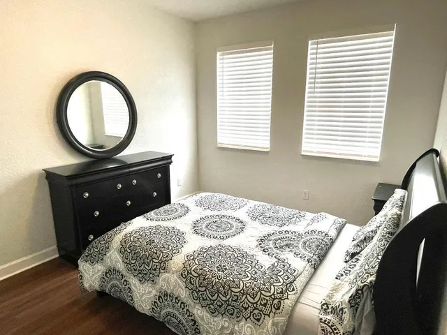 a bedroom with a bed and a dresser