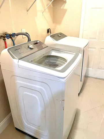 a utility room with dryer and washer