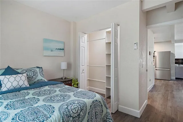 a bedroom with a bed and a view of bathroom