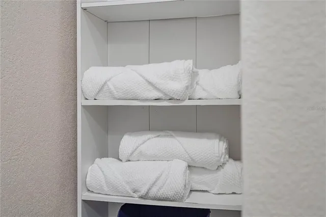 a kitchen with a sink a stove a refrigerator and cabinets