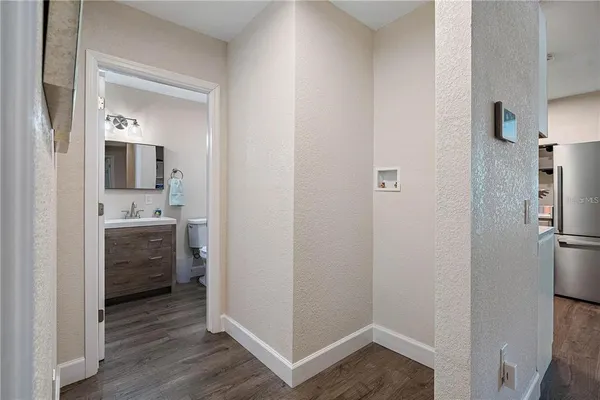 a bathroom with a sink mirror and vanity