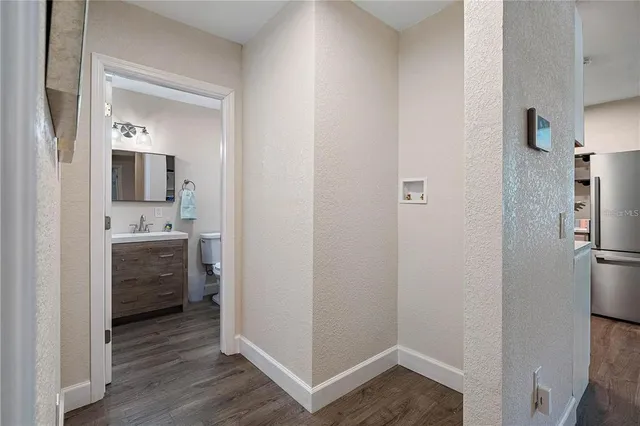 a bathroom with a sink mirror and vanity