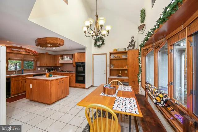 a very nice looking dining room with a large window