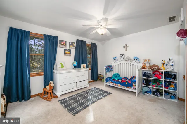 a bedroom with furniture and a bed