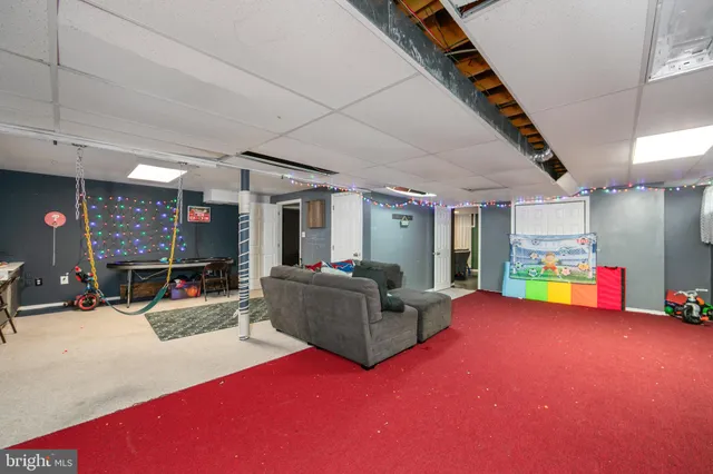 a bedroom with furniture and a flat screen tv