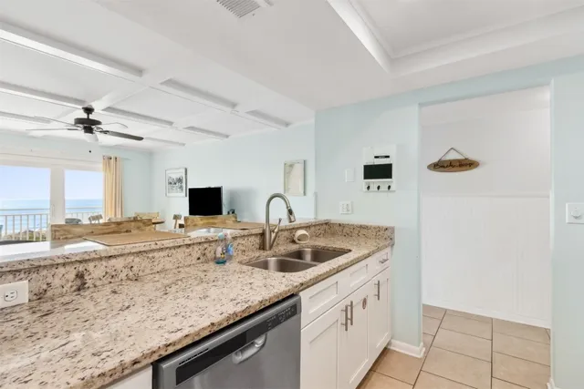 a kitchen with a granite countertop sink and a granite counter top